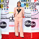 Illustration for article titled Statement Suits, Plush Pinks, and a Lotta Gowns on the American Music Awards Red Carpet